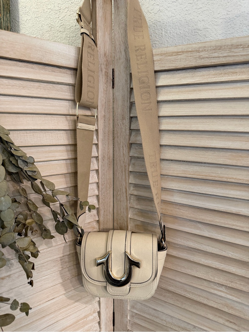 Trendy True Religion Cream Crossbody with Logo Strap and Silver Hardware